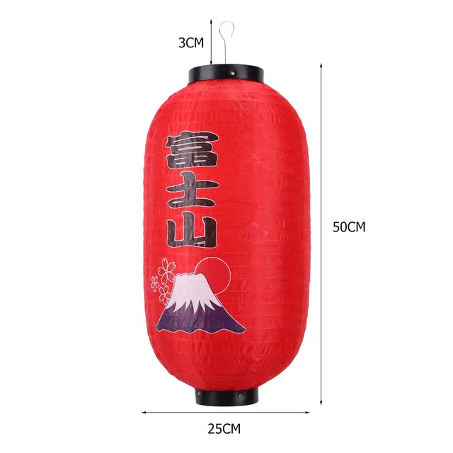 Lanterne japonaise en papier rouge avec motif du Mont Fuji et caractères kanji.
